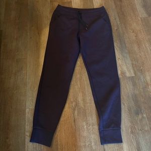 Purple fleece joggers featuring a drawstring high-rise waist
